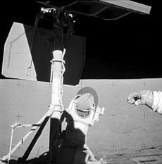Apollo 12 astronaut Conrad reaches for Surveyor 3's camera
