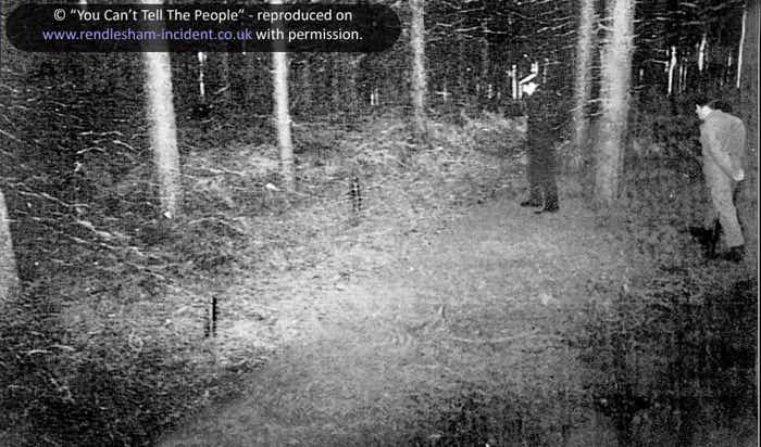 Policeman inspects the triangle of so-called landing marks in Rendlesham Forest